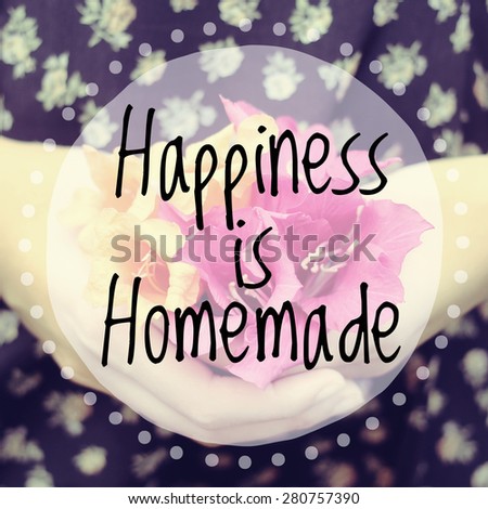 Inspirational quote on blurred hand&flower background with vintage filter