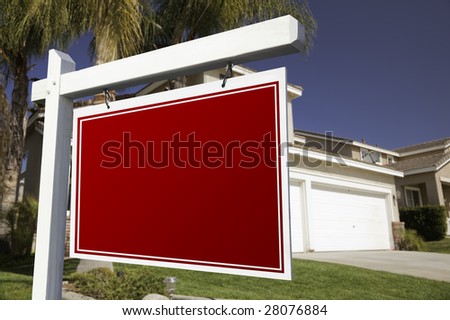 Blank Real Estate Sign in Front of House.