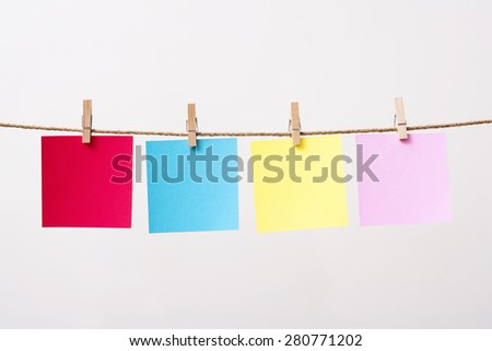 paper cards hanging rope isolated on white background
