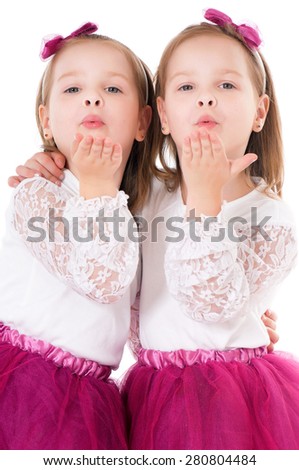 Cute little girls sends kiss goodbye, isolated on white 