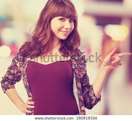 young woman pointing to the space