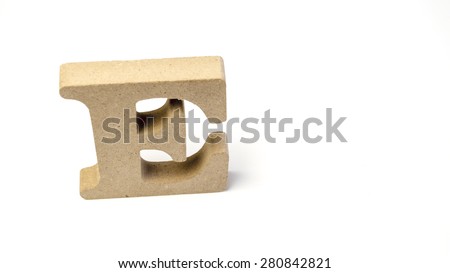 Single alphabet capital letter E wooden block. Isolated over the white background. Slightly defocused and close up shot. Copy space.