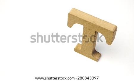 Single alphabet capital letter T wooden block. Isolated over the white background. Slightly defocused and close up shot. Copy space.