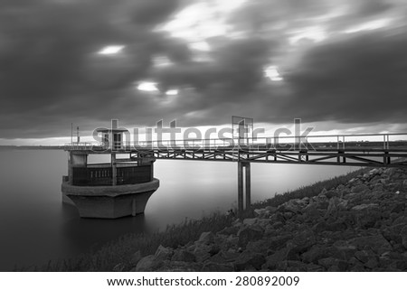 Floodgate in sunset , black and white photography