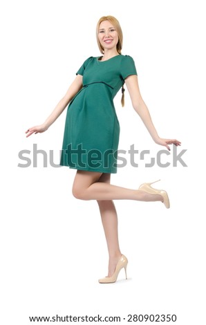 Beautiful pregnant woman in green dress isolated on white
