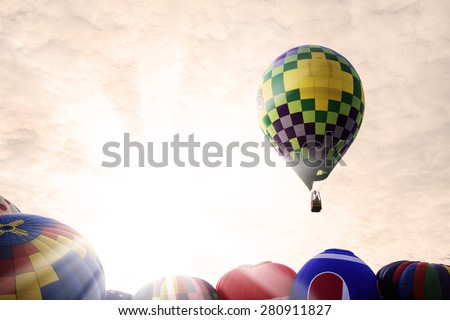 Festival of hot air balloons in the glow of the morning sun.  