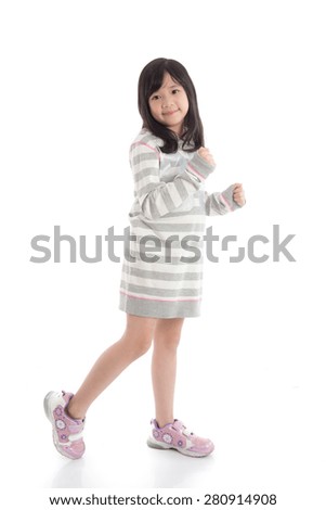 Beautiful asian girl dancing on white background isolated