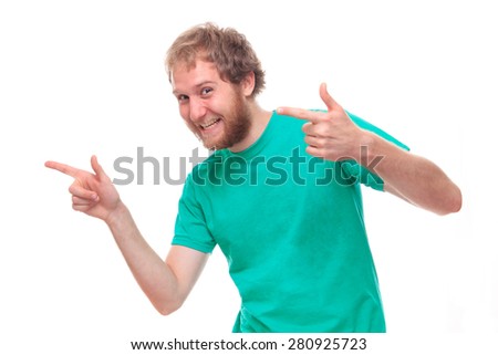 Happy bearded man pointing - studio shoot 