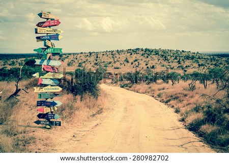 Funny directions signpost with distance to many different countries