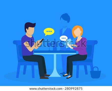 Young couple sitting in the restaurant and using smartphones for social networks