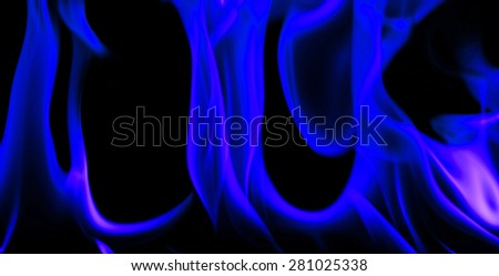 Fire and flames blue on a black background