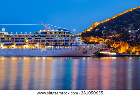 Beautiful white giant luxury cruise ship on stay at Alanya harbor Royalty-Free Stock Photo #281050655