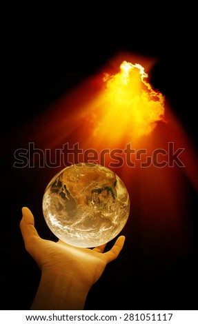Hand holding earth and light beam , concept design , Elements of image are furnished by NASA