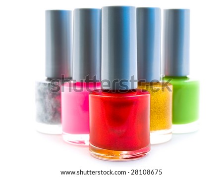 different color nail varnish bottles over white