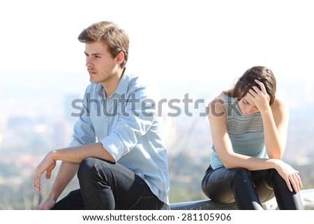Bad boy arguing with his couple breakup concept with the city in the background Royalty-Free Stock Photo #281105906