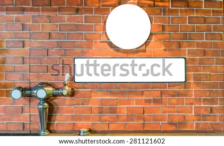 Picture frames on brick wall and Dispensing beer