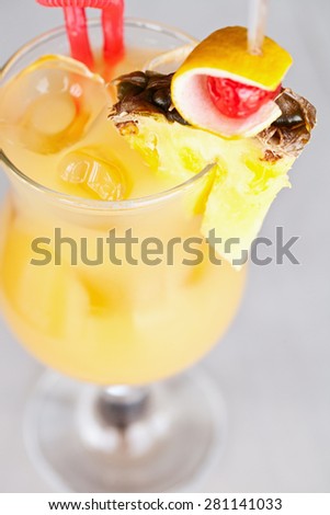 Yellow cocktail in a glass