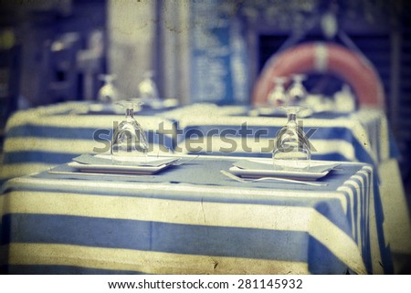 Vintage photo of glasses on a dining table 
