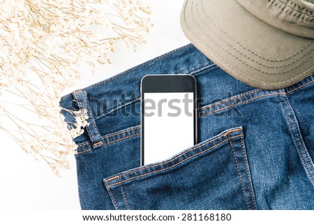 Smart phone in your pocket blue jeans with flower and cap