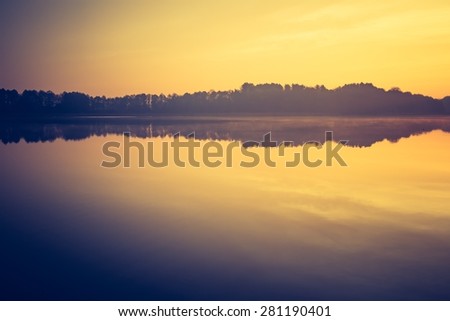Vintage photo of sunset lake