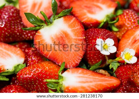 Ripe strawberries - cut and whole