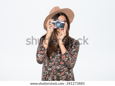 Woman photographing in studio