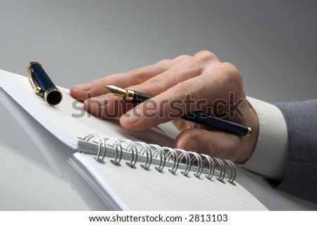 business men hand with pencil close up
