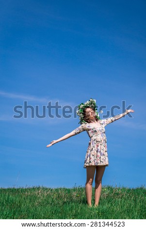 sunny woman in green field