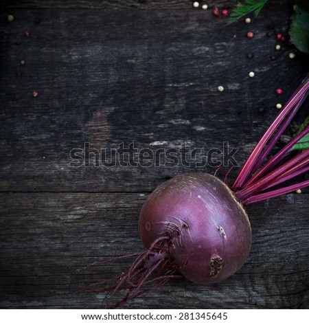 Fresh organic pattypan and beetroot on wooden background