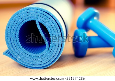 Mats for fitness classes and dumbbells - filter instagram Royalty-Free Stock Photo #281374286