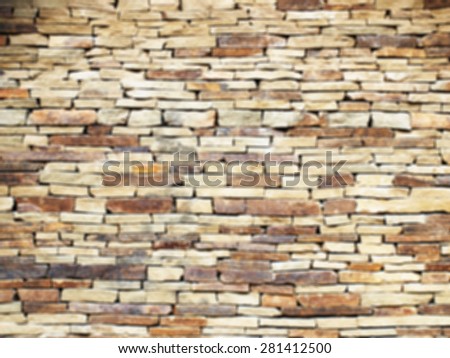 Defocused and blur image of old stone masonry from grey stone closeup was blured for background