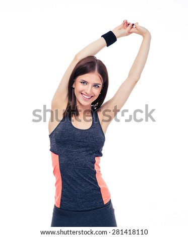 Cheerful sporty woman doing stretching exercise isolated on a white background. Looking at camera