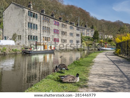 The pretty tourist town of Hebden Bridge in the South Pennine region of West Yorkshire showing steep terraced houses on the surrounding hillside Royalty-Free Stock Photo #281446979