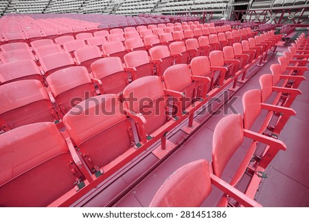 red empty chairs in the stadium before the show