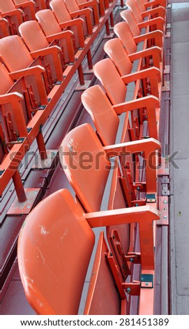red empty chairs in the stadium before the show