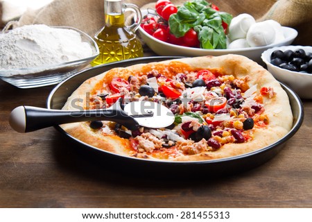 Delicious fresh pizza served on wooden table 