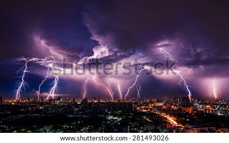 Lightning storm over city in purple light Royalty-Free Stock Photo #281493026