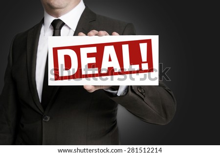 Deal sign is held by businessman.
