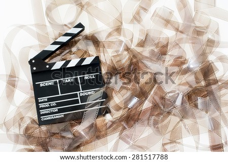 Clapper on 35mm movie unrolled filmstrip texture white background vintage color effect