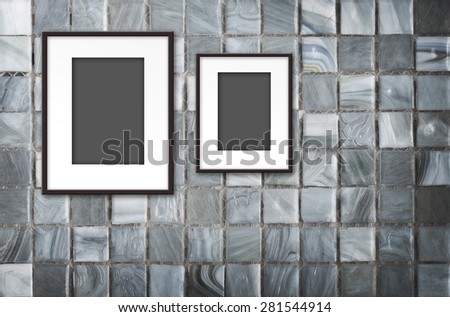 blank photo frame on Mosaic Tiles wall