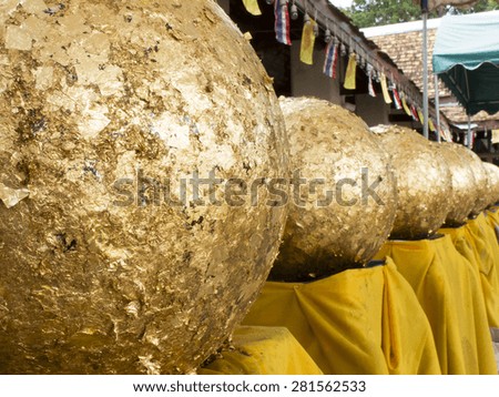 Gold leaf on loknimit (golden sphere) in Thai temple