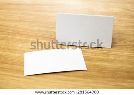 Blank Business card mock up on light wooden table, Business corporate identity, Clipping path on business card