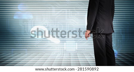 Businessman standing against grey shutters