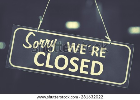 Closed sign in a shop window Royalty-Free Stock Photo #281632022