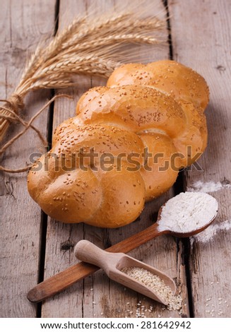 Challah bread with sesame seeds. Pastry,flour and sesame seeds.selective focus.