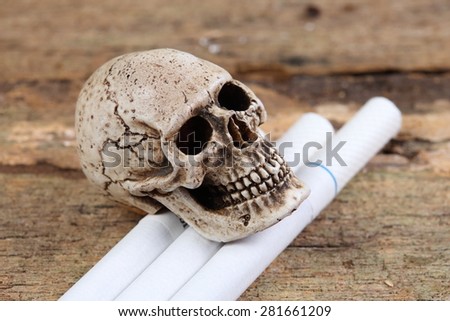 The skull  with a cigarette .