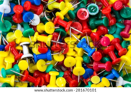 bright colorful push pins background texture 