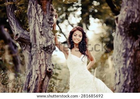 Wedding picture of happy  bride outside. 