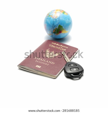 passport car key and earth ball isolated on white background concept drive around the world