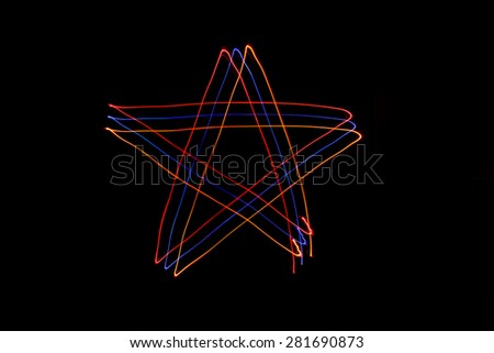 Long exposure small star neon lights texture. Modern art. Abstract star colorful neon light.